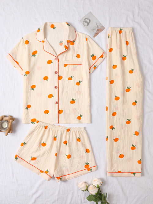 Tredelad pyjamas i mjukt tyg med lekfullt tryck med Apelsin