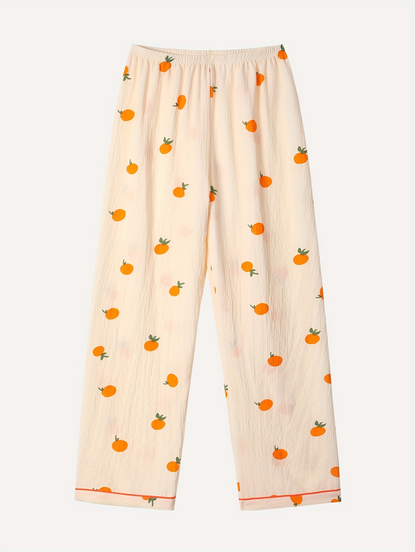 Tredelad pyjamas i mjukt tyg med lekfullt tryck med Apelsin