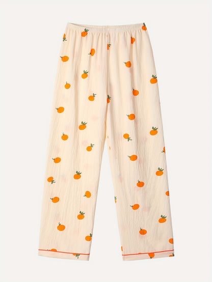Tredelad pyjamas i mjukt tyg med lekfullt tryck med Apelsin
